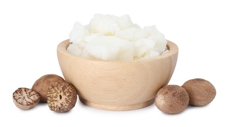 Photo of Shea butter in bowl and nuts isolated on white