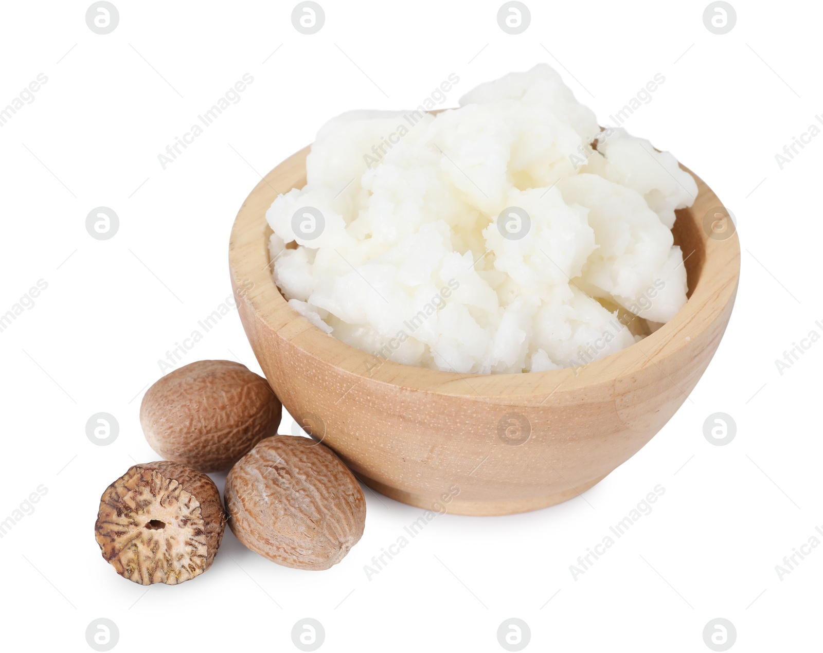Photo of Shea butter in bowl and nuts isolated on white