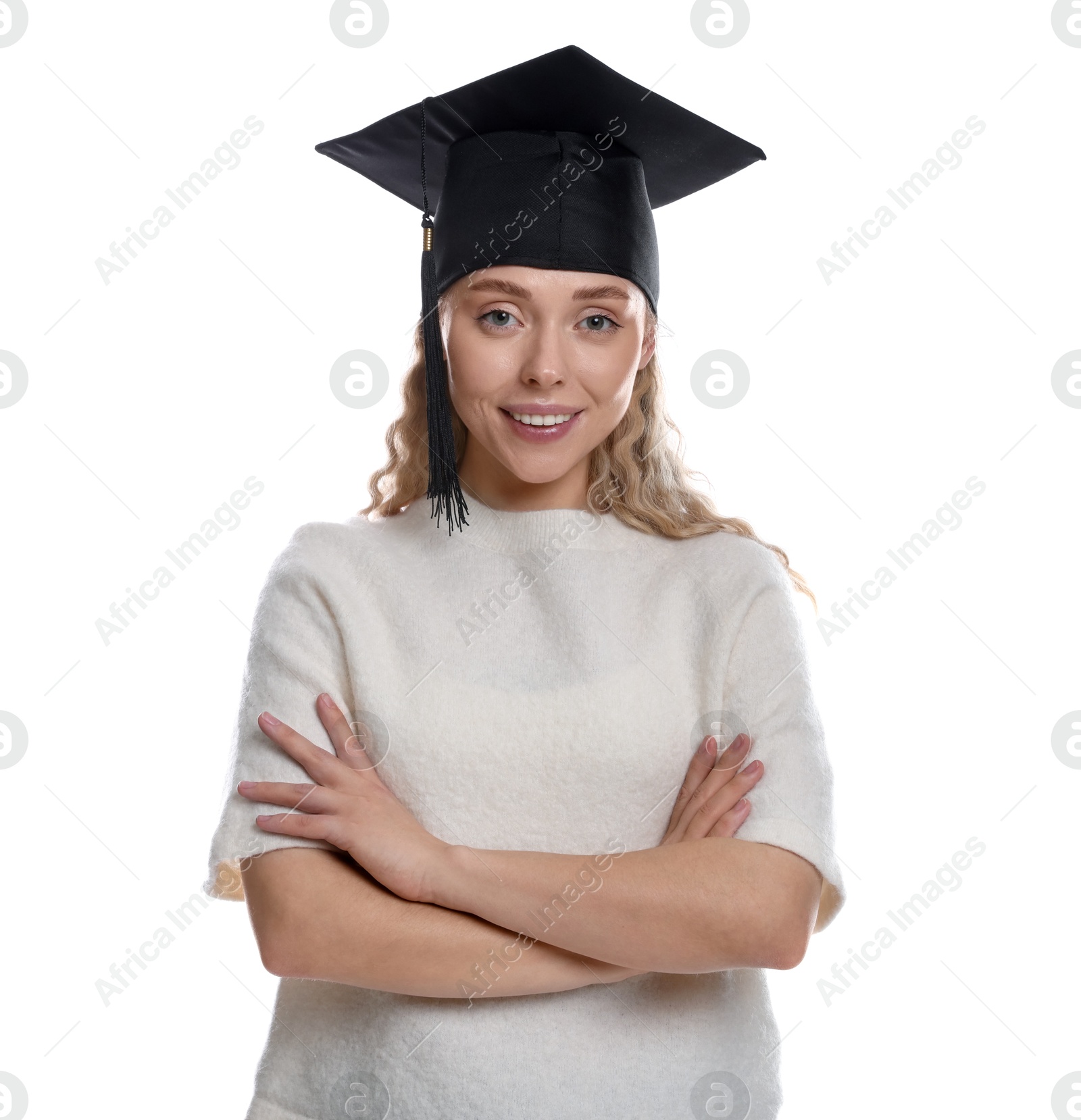 Happy student with crossed arms after graduation on white background Photo of Happy student with crossed arms after graduation on white background