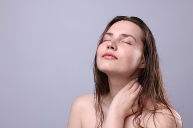 Photo of Beautiful woman with natural skin complexion on grey background, closeup. Space for text