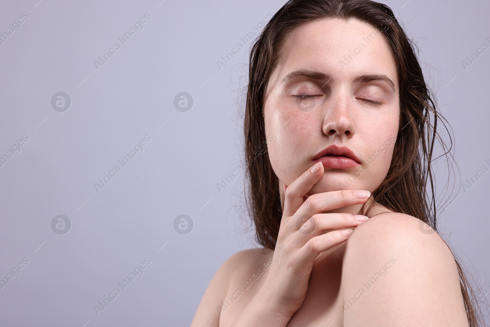 Beautiful woman with natural skin complexion on grey background, closeup. Space for text Photo of Beautiful woman with natural skin complexion on grey background, closeup. Space for text
