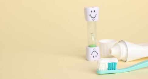 Photo of Different oral care products on beige background, closeup. Space for text