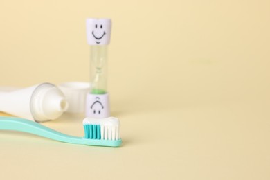 Photo of Different oral care products on beige background, closeup. Space for text