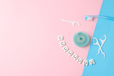 Photo of Different oral care products and teeth figures on color background, flat lay. Space for text
