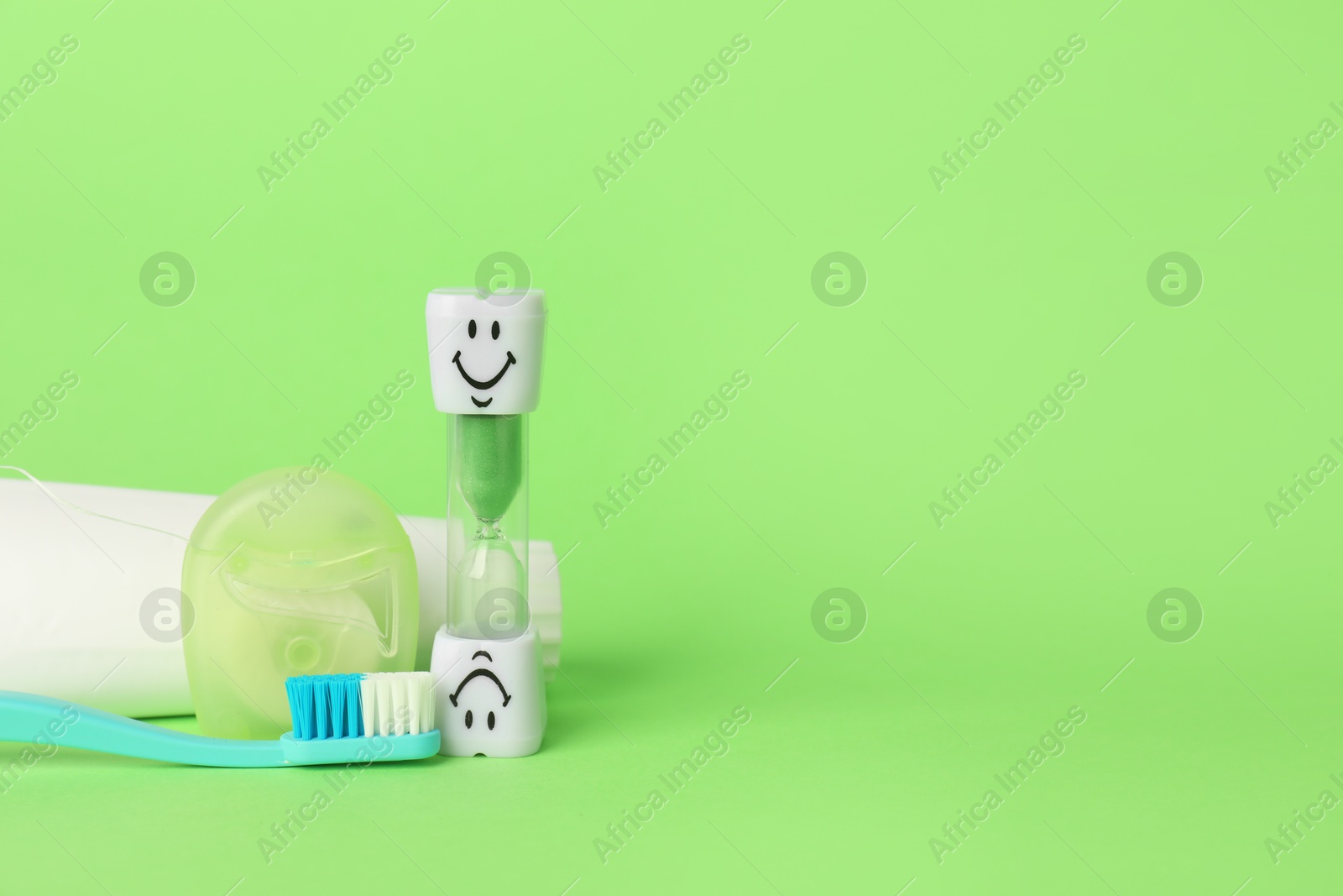 Different oral care products on green background. Space for text Photo of Different oral care products on green background. Space for text