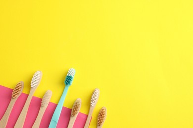 Photo of Different toothbrushes on color background, flat lay. Space for text