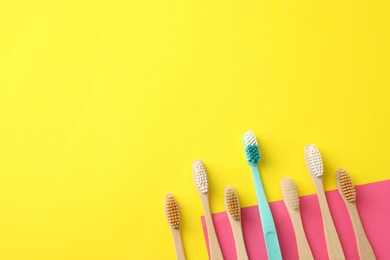 Photo of Different toothbrushes on color background, flat lay. Space for text