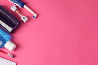 Photo of Different oral care products on pink background, flat lay. Space for text
