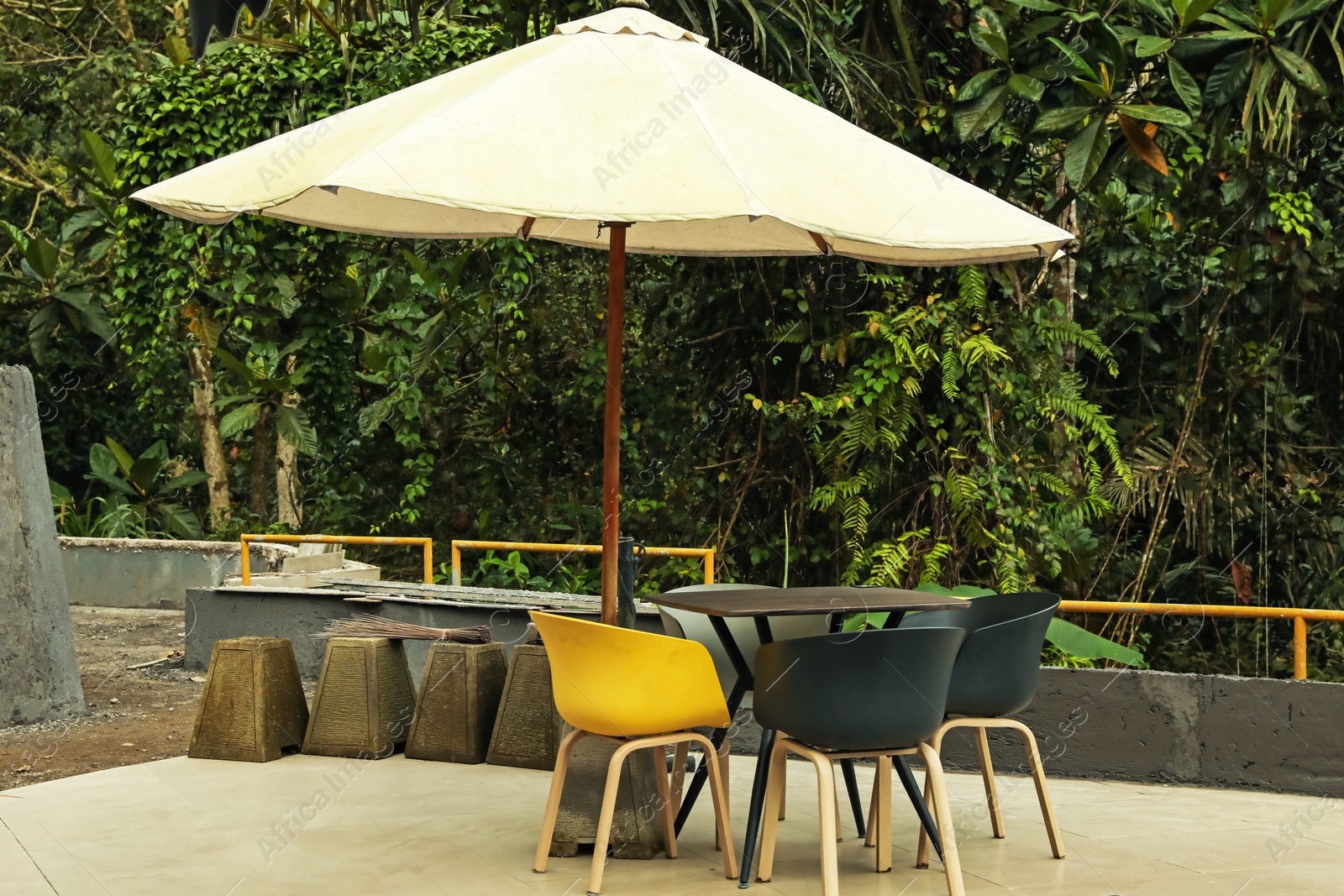 Umbrella, chairs and table at luxury resort Photo of Umbrella, chairs and table at luxury resort