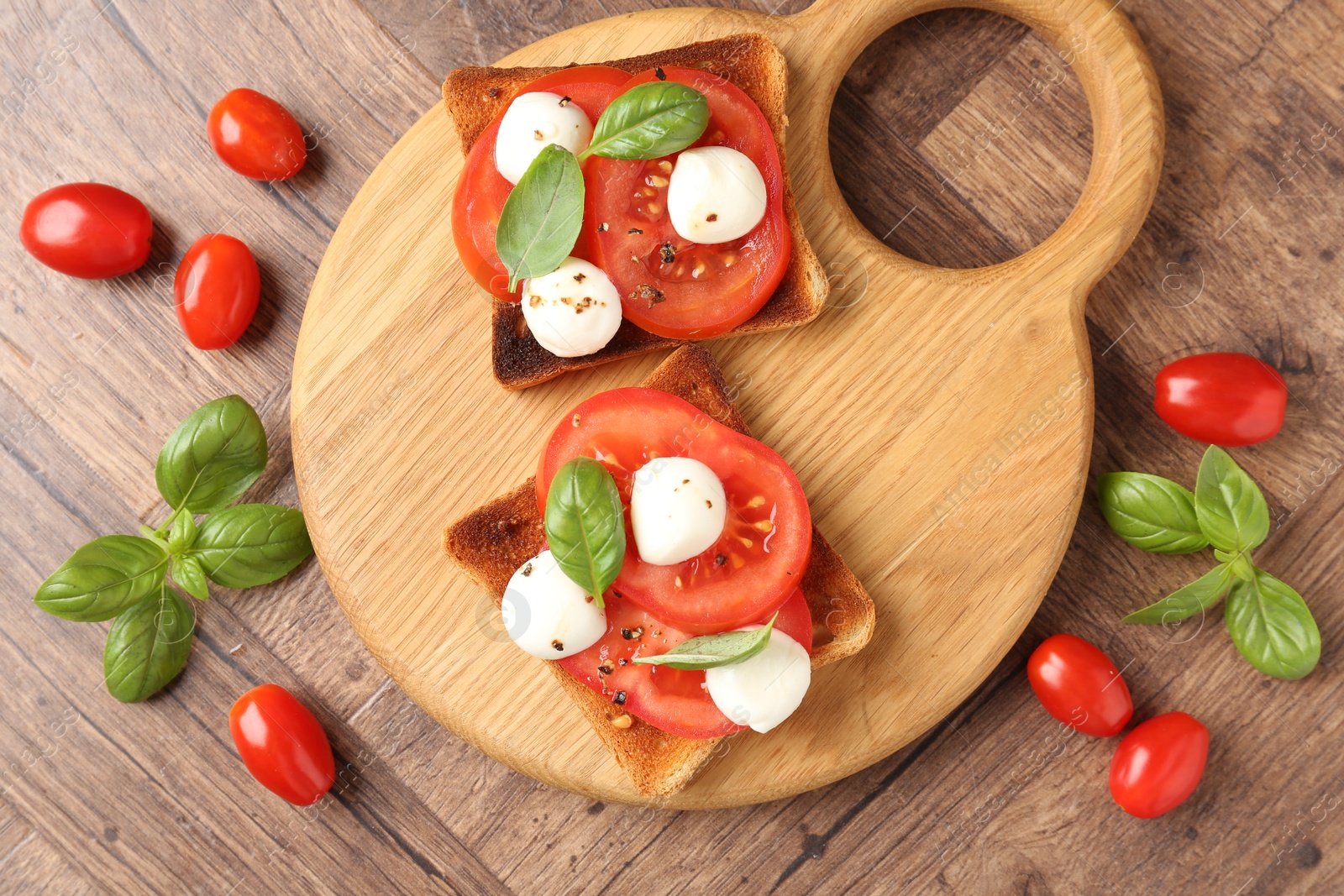 Tasty sandwiches with mozzarella cheese, tomatoes and basil on wooden table, flat lay Photo of Tasty sandwiches with mozzarella cheese, tomatoes and basil on wooden table, flat lay