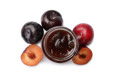 Photo of Sweet jam in jar and plums isolated on white, top view