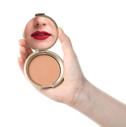 Image of Beautiful woman with red lips looking in compact powder mirror on white background, closeup