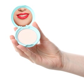 Image of Beautiful woman with red lips looking in compact powder mirror on white background, closeup