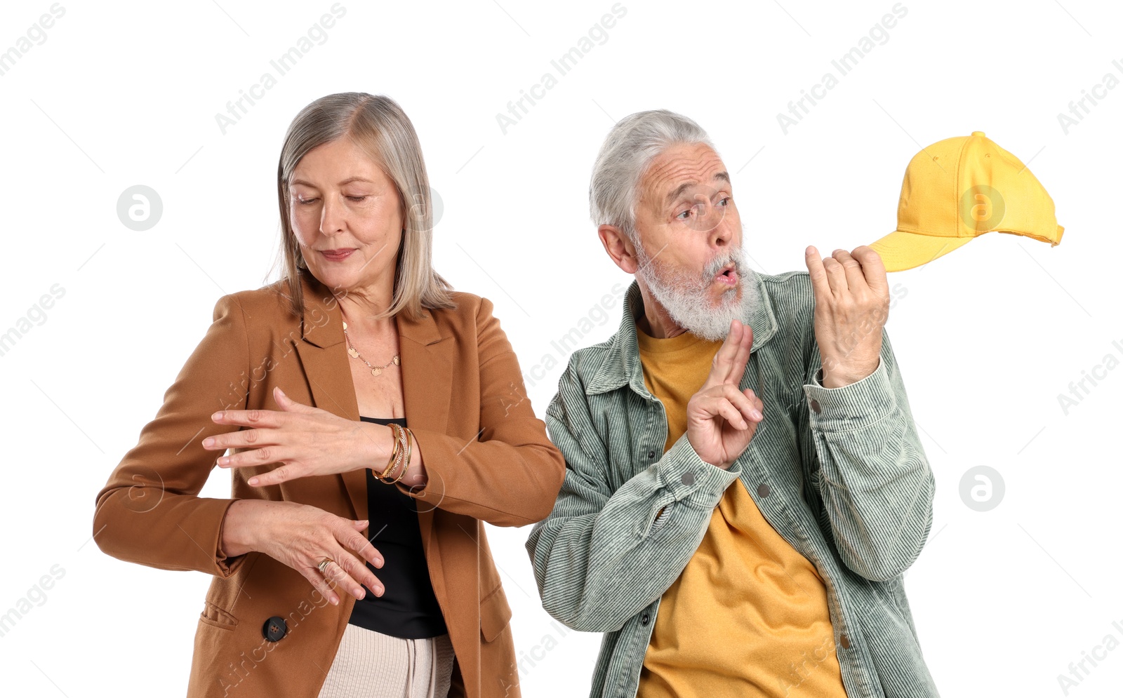 Senior couple in stylish outfits on white background Photo of Senior couple in stylish outfits on white background