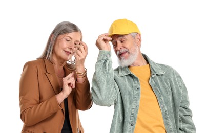 Photo of Senior couple in stylish outfits on white background