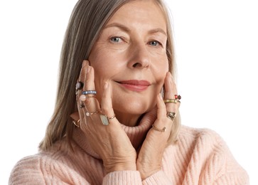Photo of Senior woman wearing different rings on white background