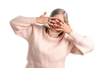 Photo of Senior woman wearing different rings on white background