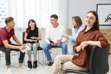Photo of Group of people having meeting during life coaching class indoors