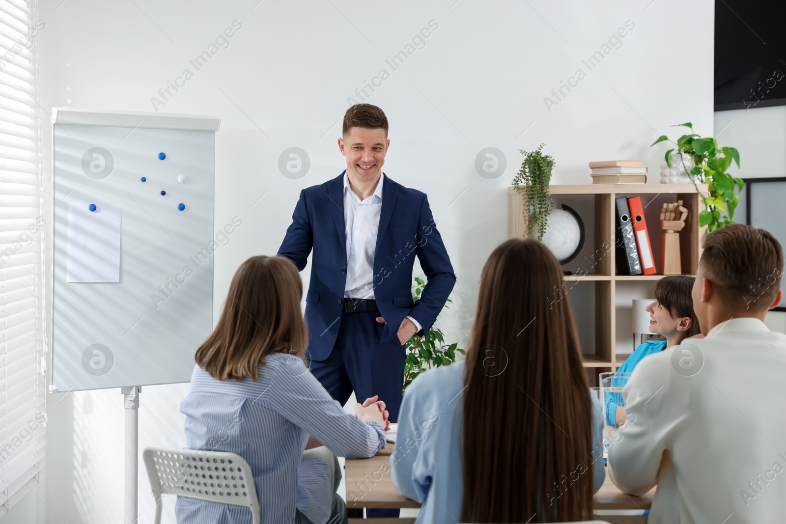 Photo of Group of people having meeting during life coaching class indoors