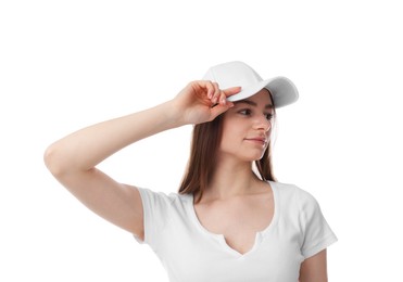 Photo of Young woman wearing stylish baseball hat on white background