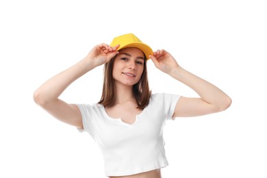 Photo of Young woman wearing stylish yellow baseball hat on white background