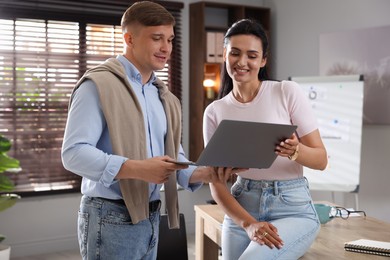 Photo of Marketing. Businesspeople with laptop working together in office