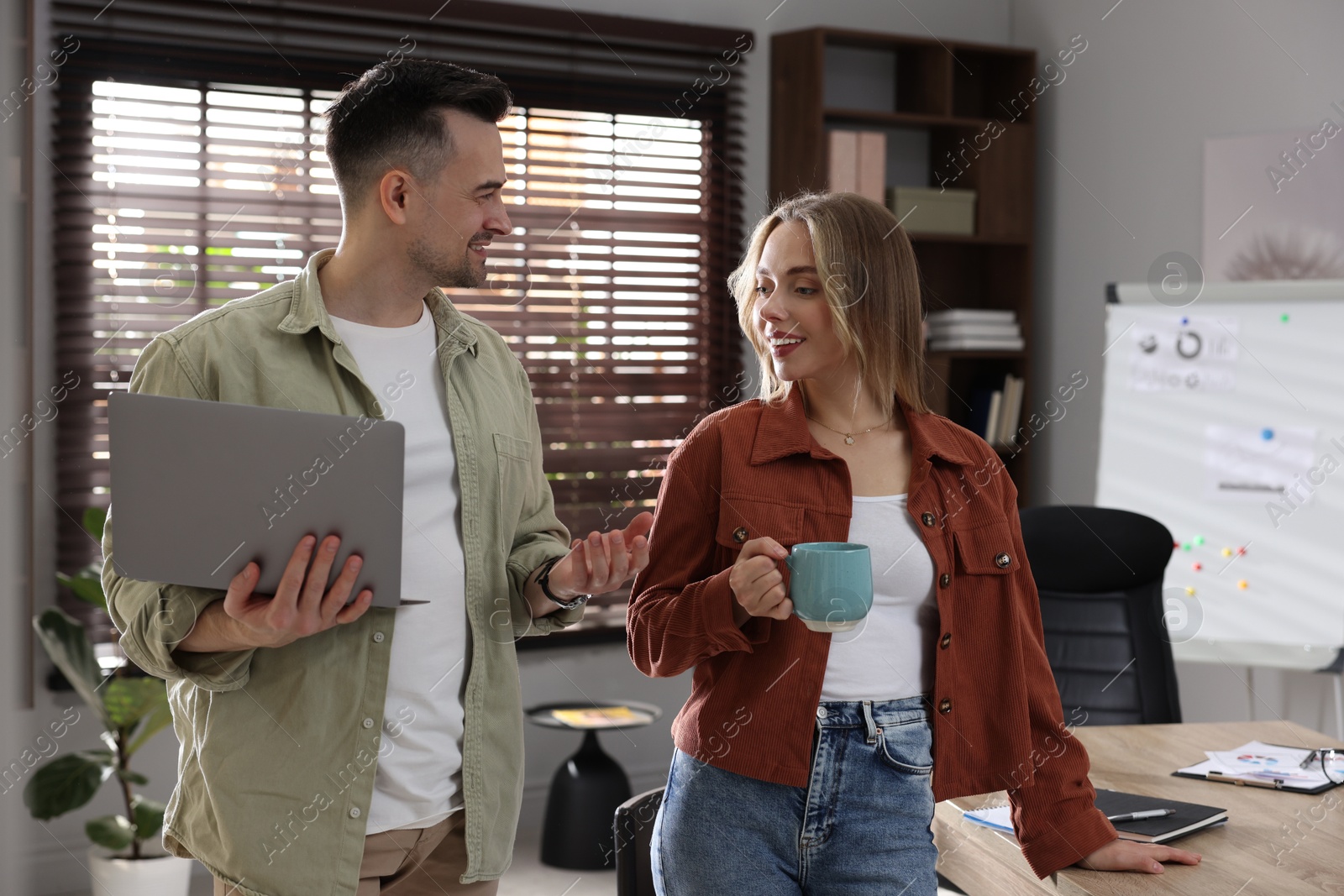Photo of Marketing. Two colleagues working together in office