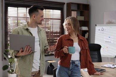 Photo of Marketing. Two colleagues working together in office