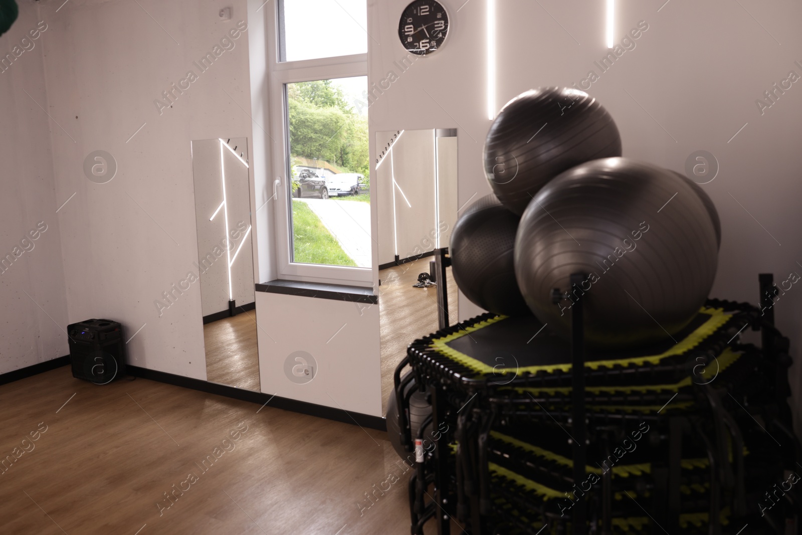 Different sports equipment and mirrors in fitness studio Photo of Different sports equipment and mirrors in fitness studio