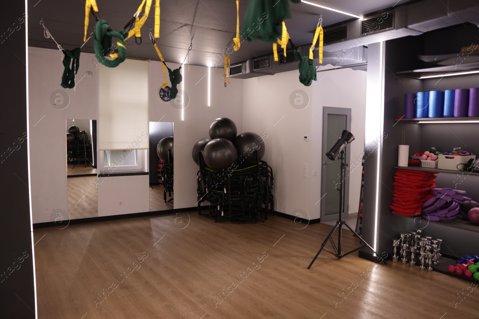 Different sports equipment, mirrors and aerial hammocks in fitness studio Photo of Different sports equipment, mirrors and aerial hammocks in fitness studio