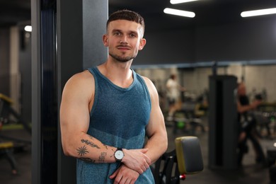 Photo of Portrait of professional personal trainer in gym