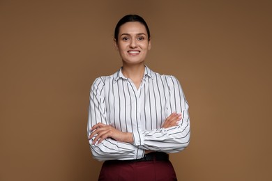 Photo of Portrait of confident business woman on brown background
