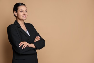 Photo of Confident business woman in suit on beige background. Space for text