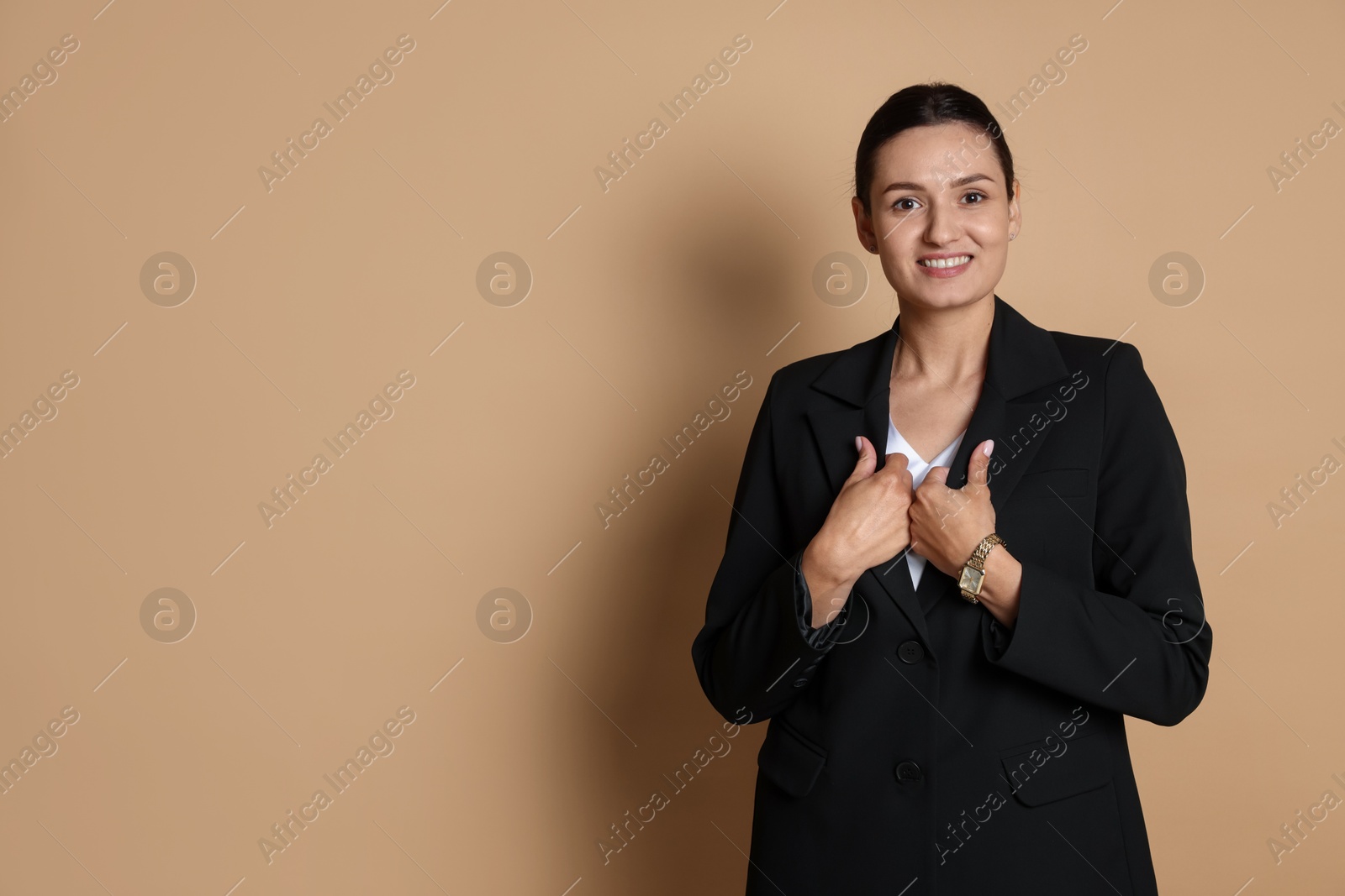 Confident business woman in suit on beige background. Space for text Photo of Confident business woman in suit on beige background. Space for text