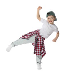 Photo of Happy little boy in baseball hat dancing on white background