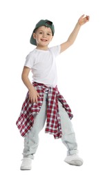 Photo of Happy little boy in baseball hat dancing on white background