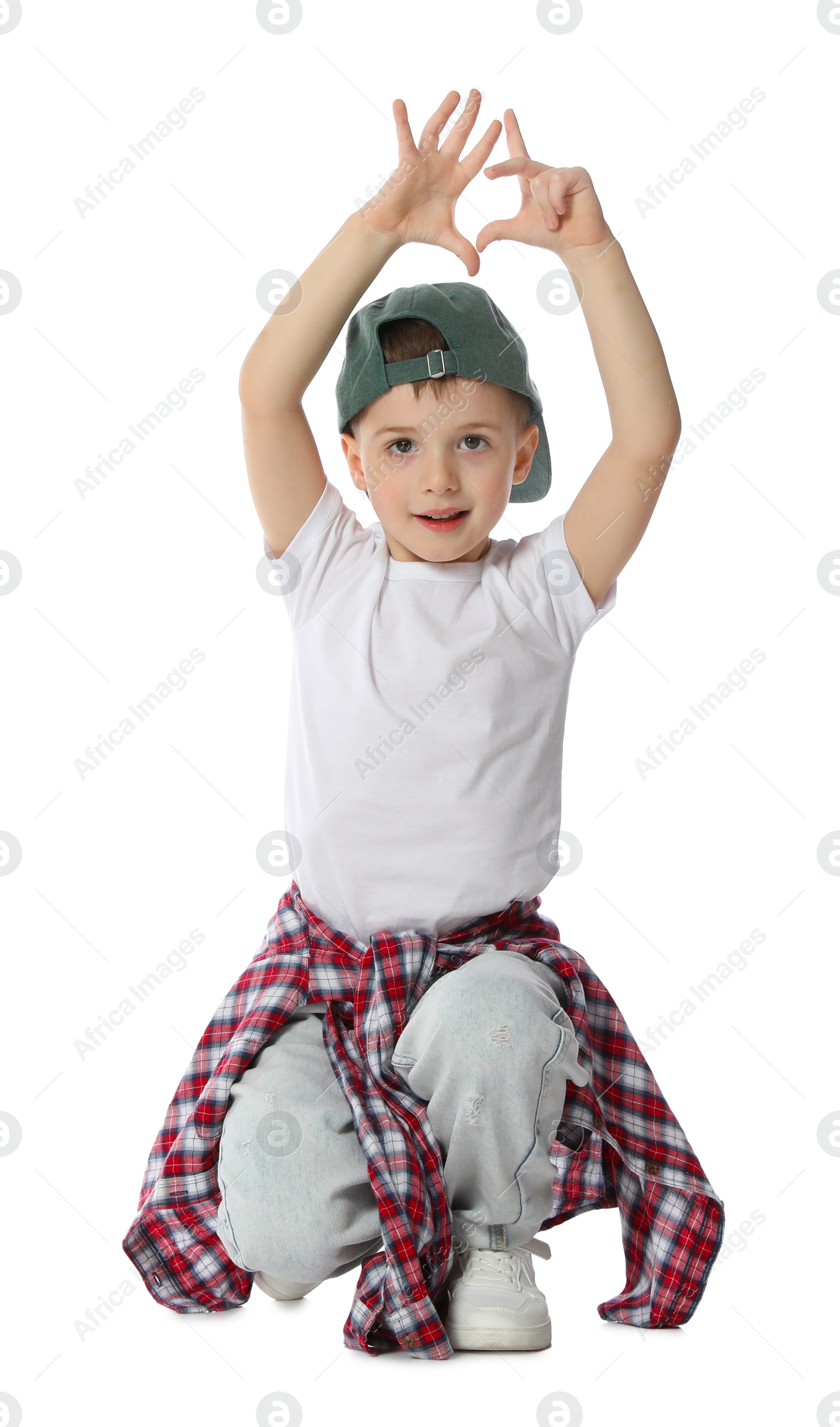 Happy little boy in baseball hat dancing on white background Photo of Happy little boy in baseball hat dancing on white background
