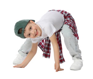 Photo of Happy little boy in baseball hat dancing on white background