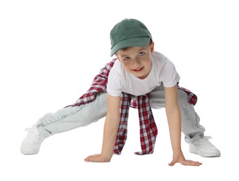 Photo of Happy little boy in baseball hat dancing on white background