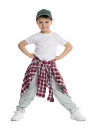 Photo of Happy little boy in baseball hat dancing on white background