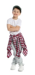 Photo of Happy little boy in baseball hat dancing on white background