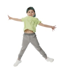 Photo of Happy little boy in baseball hat dancing on white background