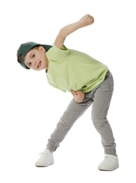 Photo of Happy little boy in baseball hat dancing on white background