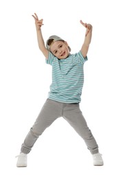 Photo of Happy little boy in baseball hat dancing on white background