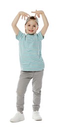 Photo of Happy little boy in baseball hat dancing on white background