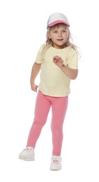 Photo of Happy little girl in baseball hat dancing on white background