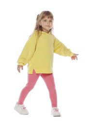 Photo of Cute little girl dancing on white background
