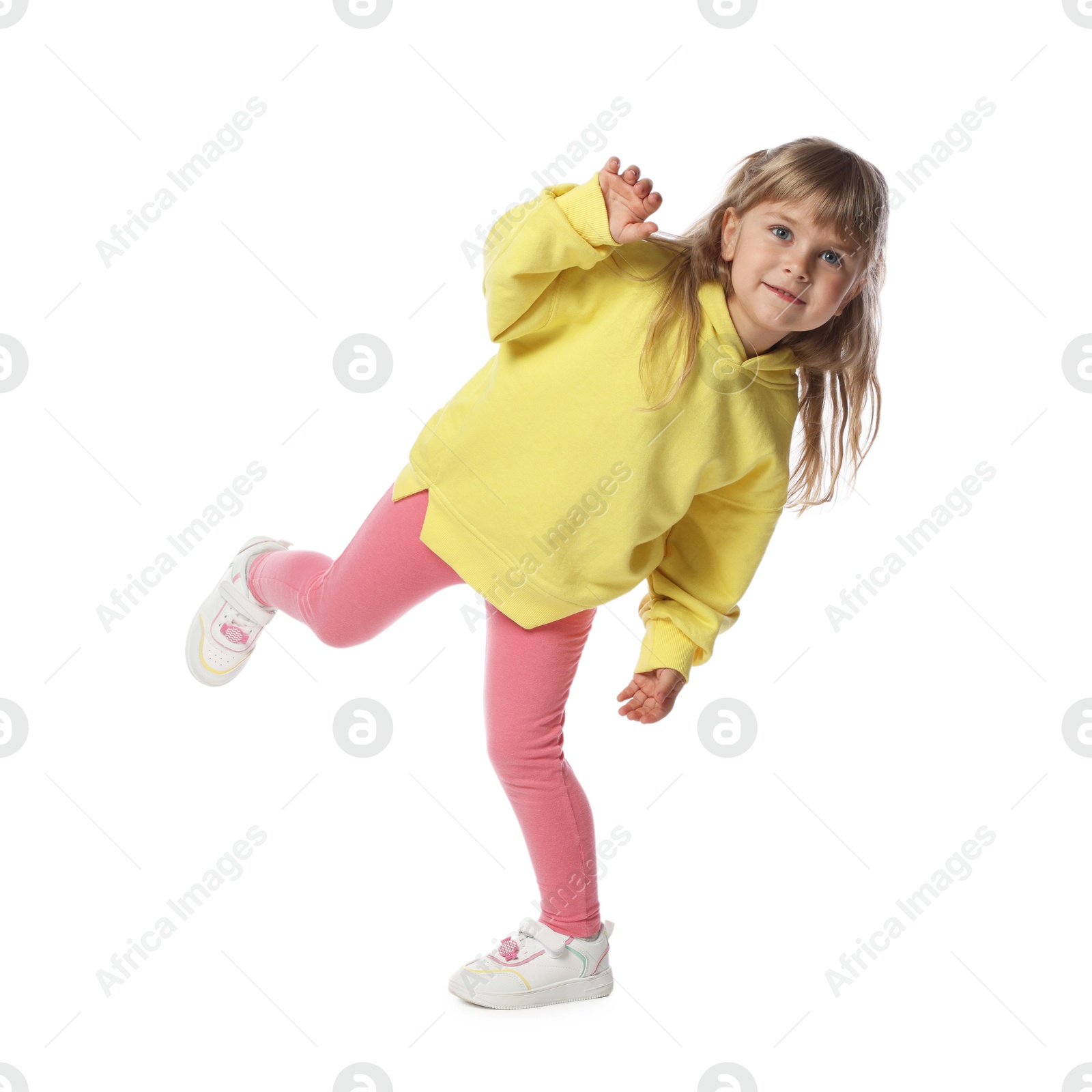 Photo of Happy little girl dancing on white background