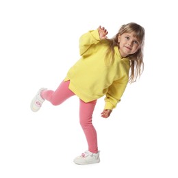 Photo of Happy little girl dancing on white background