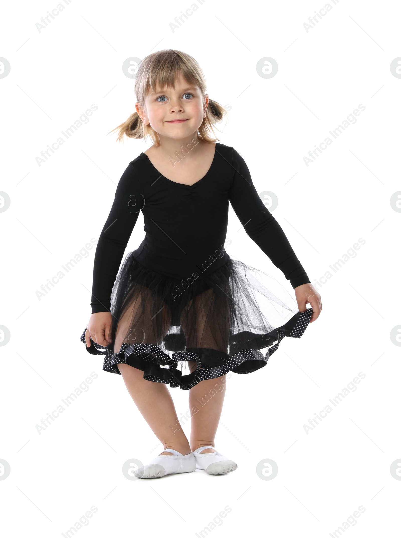 Cute little girl dancing on white background Photo of Cute little girl dancing on white background